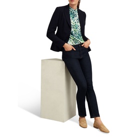 Model wearing Hobbs Beatrix Floral Blouse in white with green print, styled with navy blazer, dark jeans and tan loafers