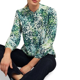 Model wearing Hobbs Beatrix Floral Blouse in white with green floral print, band collar, half button placket, three-quarter sleeves