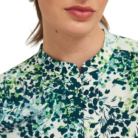 Model wearing Hobbs Beatrix Floral Blouse in white with green and teal floral print, band collar and half button placket visible