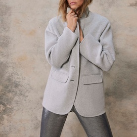 Model wearing Mint Velvet Grey Single-Breasted Blazer with notched lapel and flap pockets, styled with silver metallic trousers