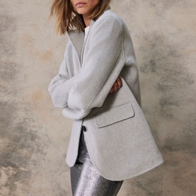 Model wearing Mint Velvet Grey Single-Breasted Blazer with notched lapel and flap pockets, styled with silver metallic trousers