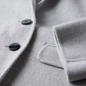 Mint Velvet Grey Single-Breasted Blazer close-up showing dark button fastening and flap pocket detail on soft wool-blend fabric