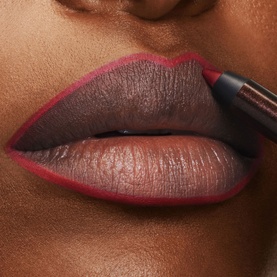 TOM FORD Runway Lip Pencil applied to lips, shown in a deep burgundy-brown shade with precise liner application on a close-up model shot