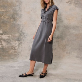Model wearing Mint Velvet grey Utility Shirt Dress, sleeveless midi length with collar, epaulettes and flap pockets