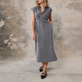 Model wearing Mint Velvet Grey Utility Shirt Dress, midi length with epaulettes and flap pockets, styled with black embellished loafers