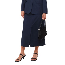 Model wearing Whistles Tailored Pinstripe Skirt in blue, midi length with front slit, styled with matching blazer; model carrying black bag