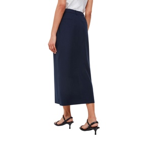Model wearing Whistles Tailored Pinstripe Skirt in blue, midi length with belt loops and front slit, styled with black kitten heel sandals