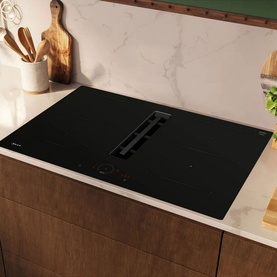 Neff N70 Aspirating Hob 80cm in black, built into marble kitchen counter with integrated extractor and touch controls