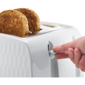 Russell Hobbs Honeycomb 4 Slice White Toaster with hand pressing the lever down, two slices of toast visible in slots