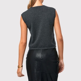 Model wearing Helen McAlinden Marlena Cashmere Top in grey with cap sleeves and ribbed trim, styled with black leather skirt, rear view