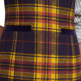 Model wearing Hobbs Margot Check Mini Dress in blue yellow tartan check wool, sleeveless with front pocket detail, styled with striped top underneath