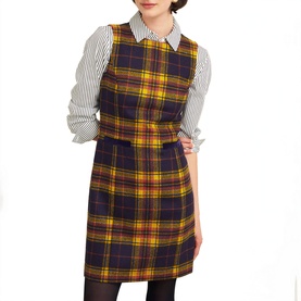 Model wearing Hobbs Margot Check Mini Dress in blue check wool, sleeveless with round neckline, styled over a striped long-sleeve shirt