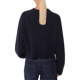 Model wearing Whistles Relaxed Cropped Sweater in blue wool, back view, crew neck, long sleeves, cropped length, paired with dark jeans