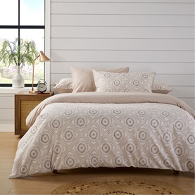 Christys 180 Thread Count Amara Duvet Set Multi, cotton bedding with printed geometric medallion design in neutral tones, styled on a double bed