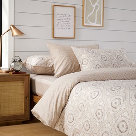 Christys 180 Thread Count Amara Duvet Set Multi, geometric circle print in neutral tones, styled on a double bed with matching pillowcases