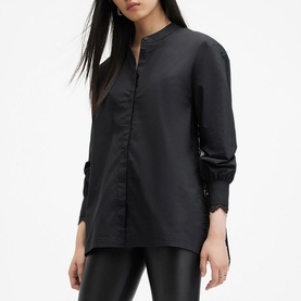 Model wearing All Saints Ethel Lace Embellished Shirt in black, mandarin collar, long sleeves with single-button cuffs, styled with black trousers