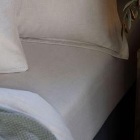 Christys Flannel Marl Single Fitted Sheet in cream, 100% brushed cotton with soft finish, styled on a bed with matching pillowcase