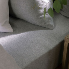Christys Flannel Marl Single Fitted Sheet in silver, 100% brushed cotton with soft textured finish, styled on a bed with matching pillow