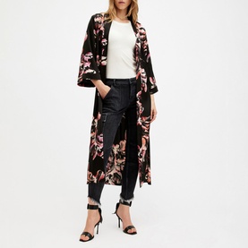 Model wearing All Saints Carine Floral Kimono in black with pink floral print, styled with white tee, dark jeans and black heeled sandals