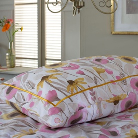 The Lyndon Company Mary Mary Duvet Set in multi, 100% cotton, featuring pink and yellow floral print on white, styled on a bed