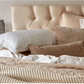 Christys Daisy Meadow Duvet Set Hazelnut in brown cotton sateen with printed design and piped trim, styled on a bed with cushions