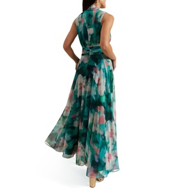 Model wearing Phase Eight Lucinda Floral Dress in multi, showing back view of teal watercolour floral maxi with waist detail and flared skirt