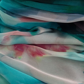 Phase Eight Lucinda Floral Dress fabric close-up showing teal and multi watercolour-inspired hand-painted floral print on sheer polyester