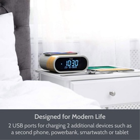 IBox Radio Silver alarm clock radio on bedside table, showing digital display, styled in bedroom setting with USB charging ports