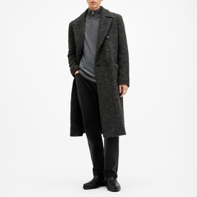 Model wearing All Saints Kilburn Half-Zip Sweater in grey, styled with a dark herringbone overcoat and black trousers