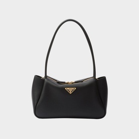Prada Accessories Darling Medium Leather Handbag in black with single top handle, gold-tone triangle logo hardware, and zip fastening
