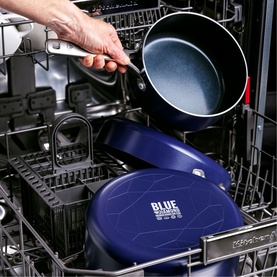 Blue Diamond Non-Stick Frypan 30cm in blue being placed into a dishwasher, demonstrating dishwasher-safe feature