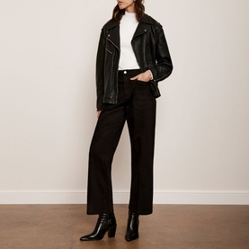 Model wearing Mint Velvet Black Cropped Wide Leg Jeans with a white top, black leather jacket and black ankle boots