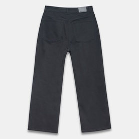 Mint Velvet Cropped Wide Leg Jeans in black, rear view showing five-pocket style, logo badge, and wide-cut leg silhouette