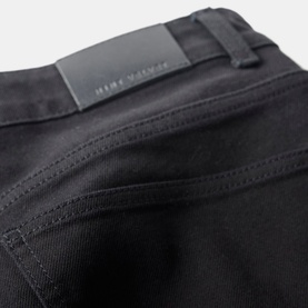 Mint Velvet Black Cropped Wide Leg Jeans close-up showing logo badge detail at back waistband, button and fly zip fastening