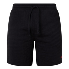 Hugo Austin Logo Drawstring Lounge Shorts in black waffle-finish fabric with elasticated drawstring waist and small red logo detail.