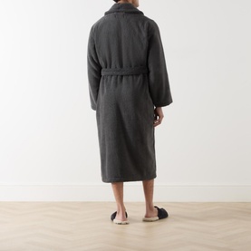 Model wearing Ralph Lauren Polo Player Logo Robe in grey plush cotton, rear view, with shawl collar, self-fabric belt, and black slippers