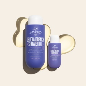 Sol De Janeiro Delicia Drench Shower Oil in full-size and travel-size purple bottles shown together with product texture swatch