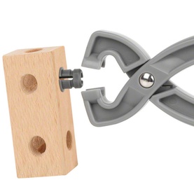 Brio Builder Starter Construction Set grey plastic pliers gripping a wooden block with drilled holes, showing construction play detail