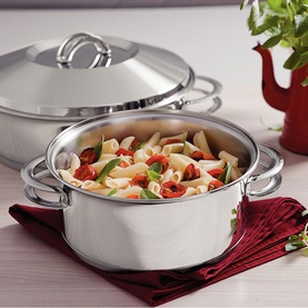 Tramontina Stainless Steel Saute Pan with Handles 28cm filled with penne pasta, tomatoes and basil, lid resting alongside on white surface