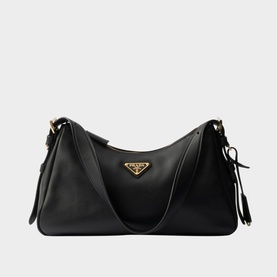 Prada Accessories Aim&eacute;e Medium Leather Shoulder Bag in black with gold-tone triangle logo, zip fastening, and leather shoulder strap