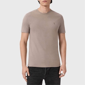 Model wearing All Saints Three-Pack Brace Ramskull Logo T-Shirt in taupe with short sleeves, Ramskull logo embroidery, paired with dark jeans