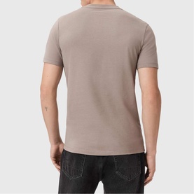 Model wearing All Saints Three-Pack Brace Ramskull Logo T-Shirt in taupe, back view, paired with dark jeans
