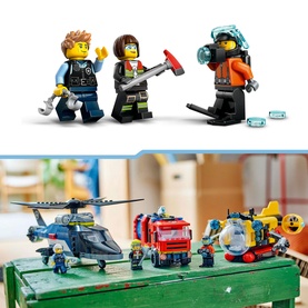 Lego City Helicopter, Fire Engine & Submarine Remix set with 3 minifigures posed above the built vehicles displayed on a surface