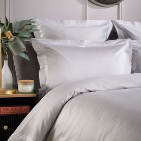 Karla Bree Triple Row Cord 800 Thread Count Oxford Pillowcase in grey with white triple cord detail, styled on a made bed