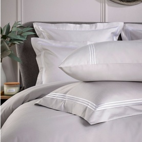Karla Bree Triple Row Cord 800 Thread Count Oxford Pillowcase in grey with white cord trim detail, styled on a made bed
