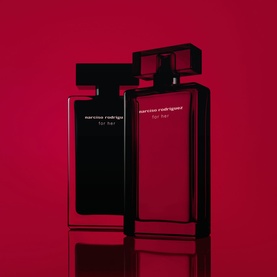 Narciso Rodriguez For Her Eau de Parfum Intense 50ml, two black and red bottles against deep red background