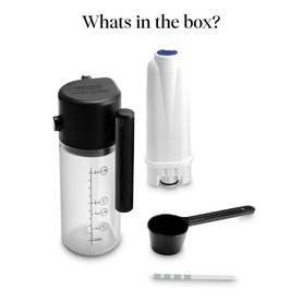 Black and white water filter jug components laid out: clear carafe with black lid, white filter cartridge, black measuring scoop, and cleaning brush
