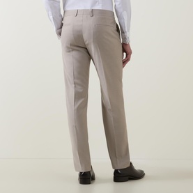 Model wearing Strellson Melvin Slim Fit Suit Trousers in beige, rear view showing pressed creases, belt loops and back pockets