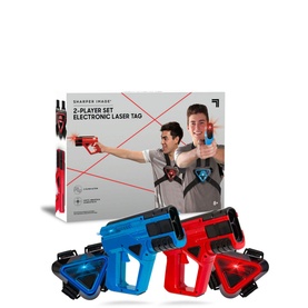 FAO Sharper Image Two-Player Electronic Laser Tag Set with two guns in blue and red, matching target vests, and retail packaging shown behind