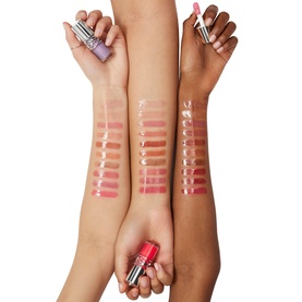 YSL Loveshine Plumping Lip Oil Gloss in Thunder Stealer, shown as arm swatches across three skin tones with lipstick bullet